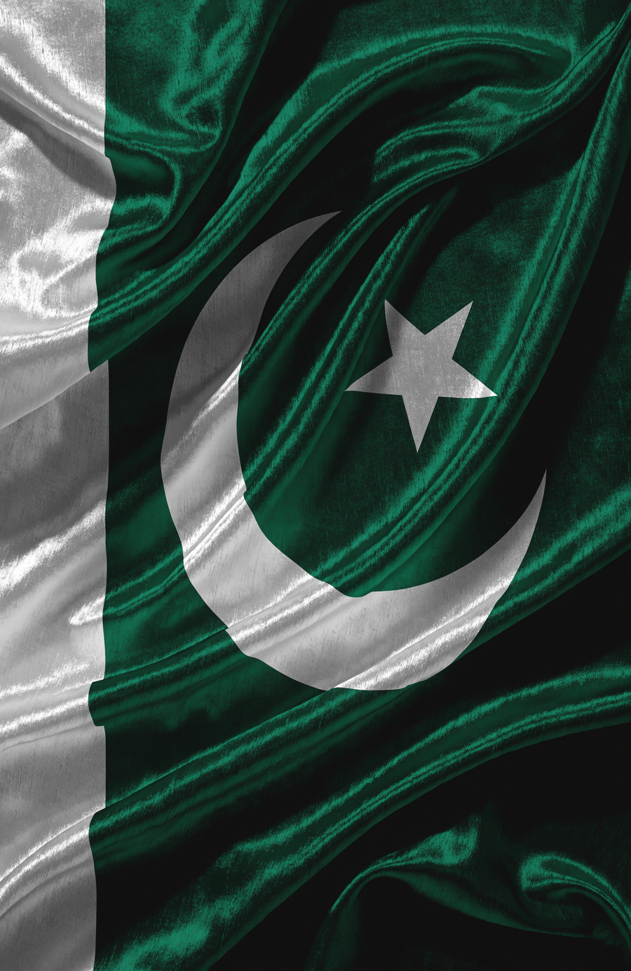 The Pakistani flag flows across deep green satin, the white crescent and star glowing against the folds