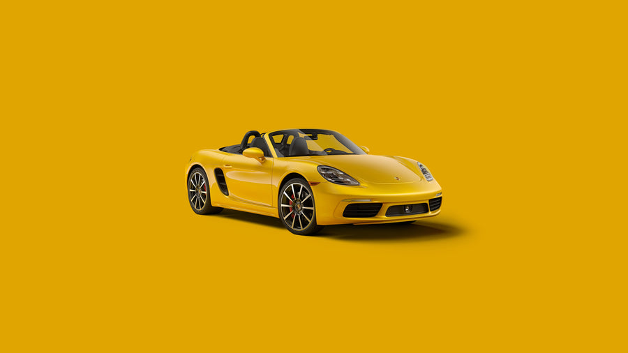 Porsche 718 Boxster - a yellow convertible against a flat ochre ground — nothing else in the frame, on a metal wall art plate
