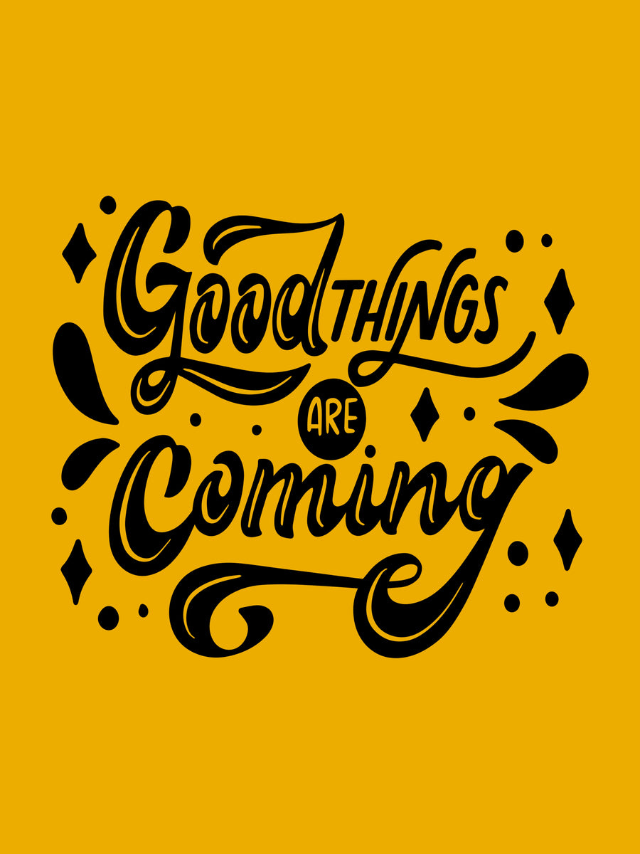Good Things Are Coming - “Good things are coming” in hand-drawn lettering, black on mustard yellow — swashed script, on a metal wall art plate