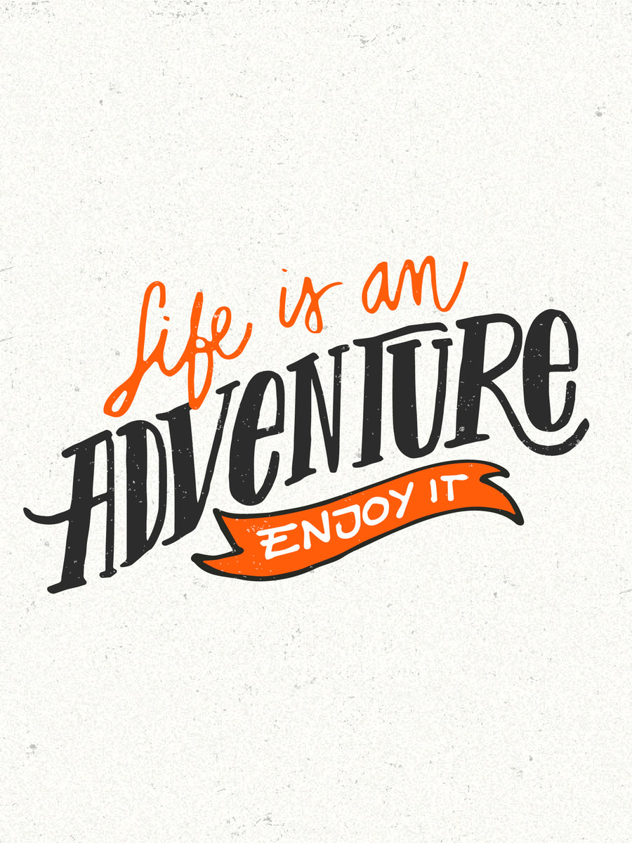 Life Is An Adventure - “Life is an adventure - enjoy it” in hand-drawn lettering, orange and black on pale grey —, on a metal wall art plate