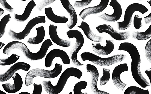 Maze - a black and white organic maze, the shapes locking into one another, on a metal wall art plate