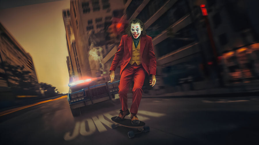 The Joker – Skateboard - a clown skating away down the middle of the road, police car behind, on a metal wall art plate